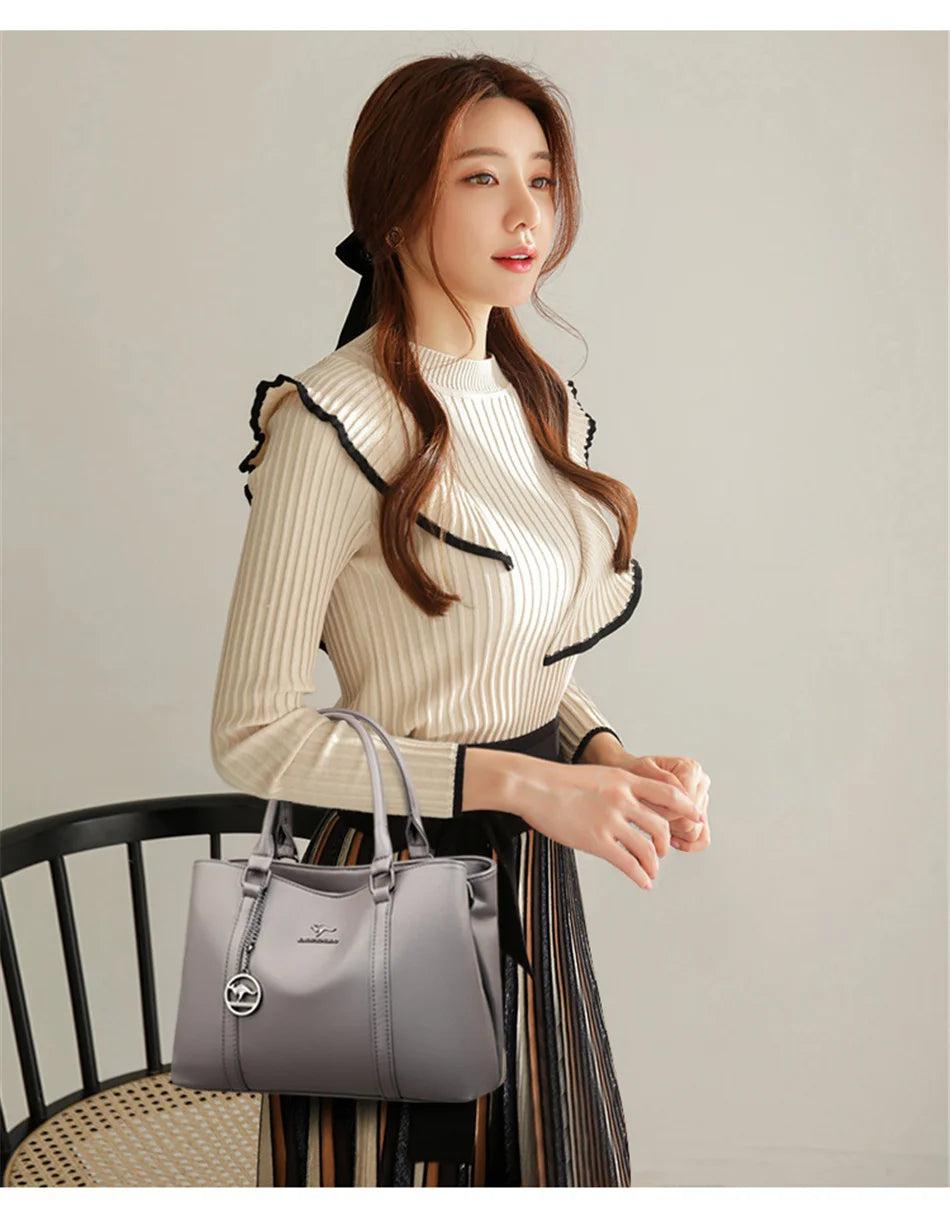 Masterpiece Grained Leather Messenger Bag