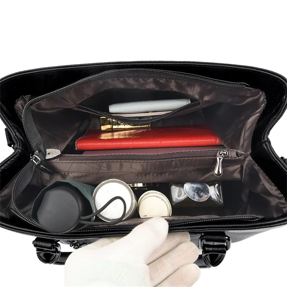 Masterpiece Grained Leather Messenger Bag